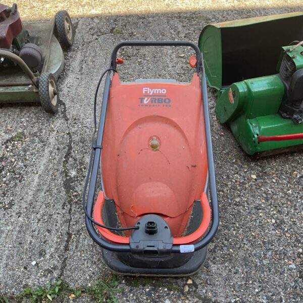 Flymo Turbo Compact 380 lawnmower in a garden setting.