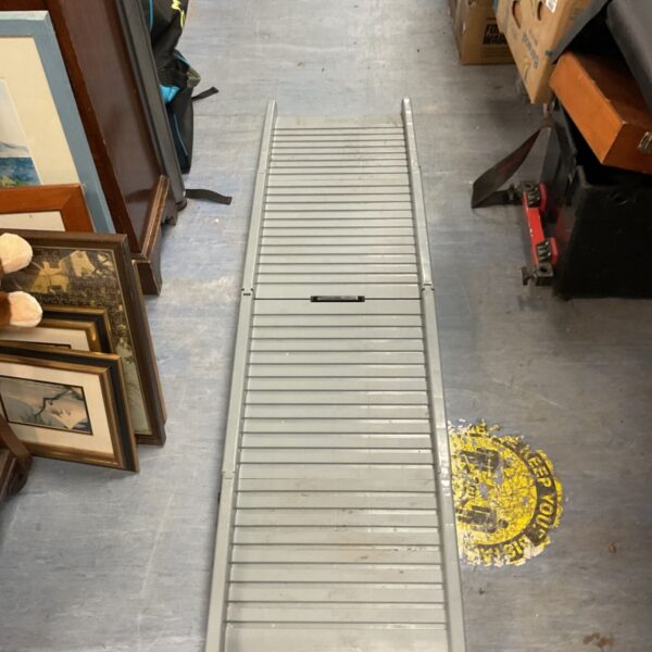 Metal foldable pet ramp for dogs and animals, showing slat construction.