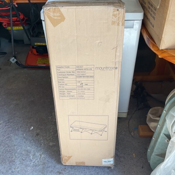 Foldaway single bed packed in a bag, ready for storage or transport.