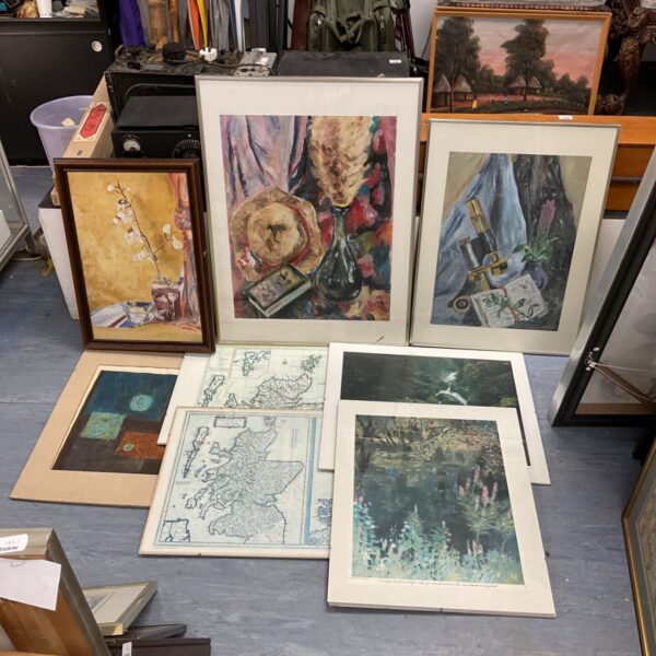 Framed art collection including still life oil paintings and prints.