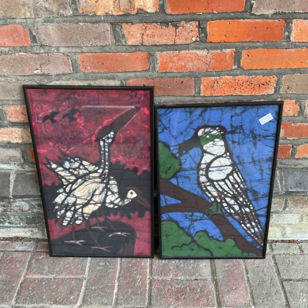 Pair of vintage framed bird prints with colourful batik style.