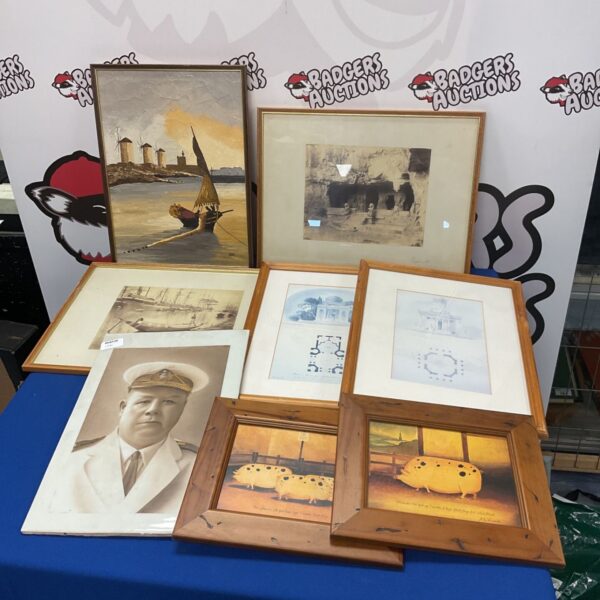 Collection of framed prints and artworks including seascape and pig prints.
