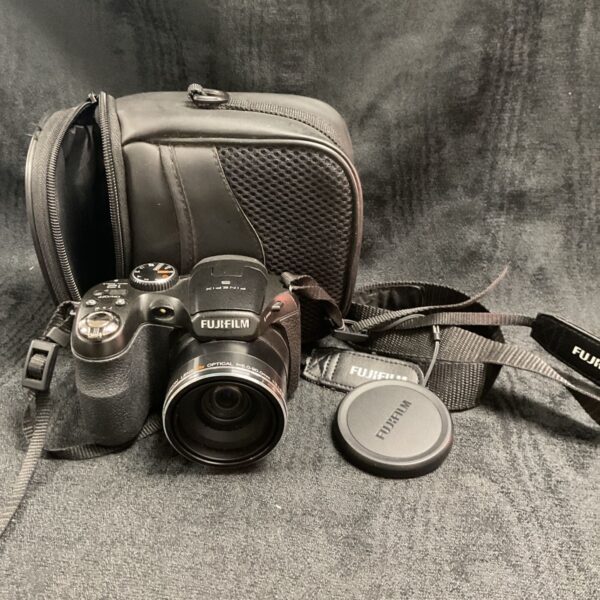 Fujifilm FinePix digital camera with black carrying case.