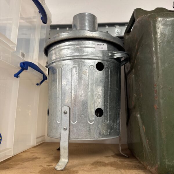 Vintage galvanised garden burner with hinged door for ash removal.
