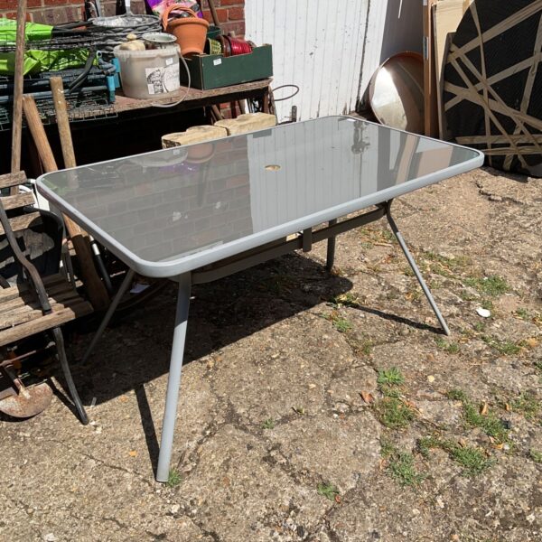 Six foot garden glass table with metal frame.