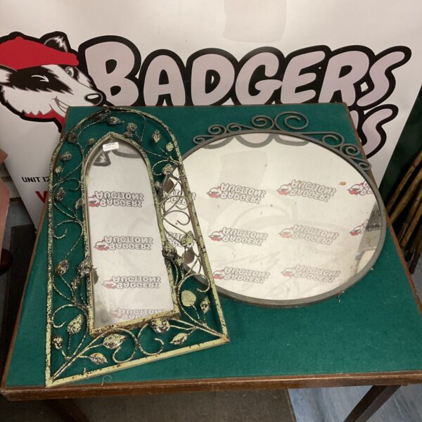 Vintage metal framed garden mirror with floral detailing.