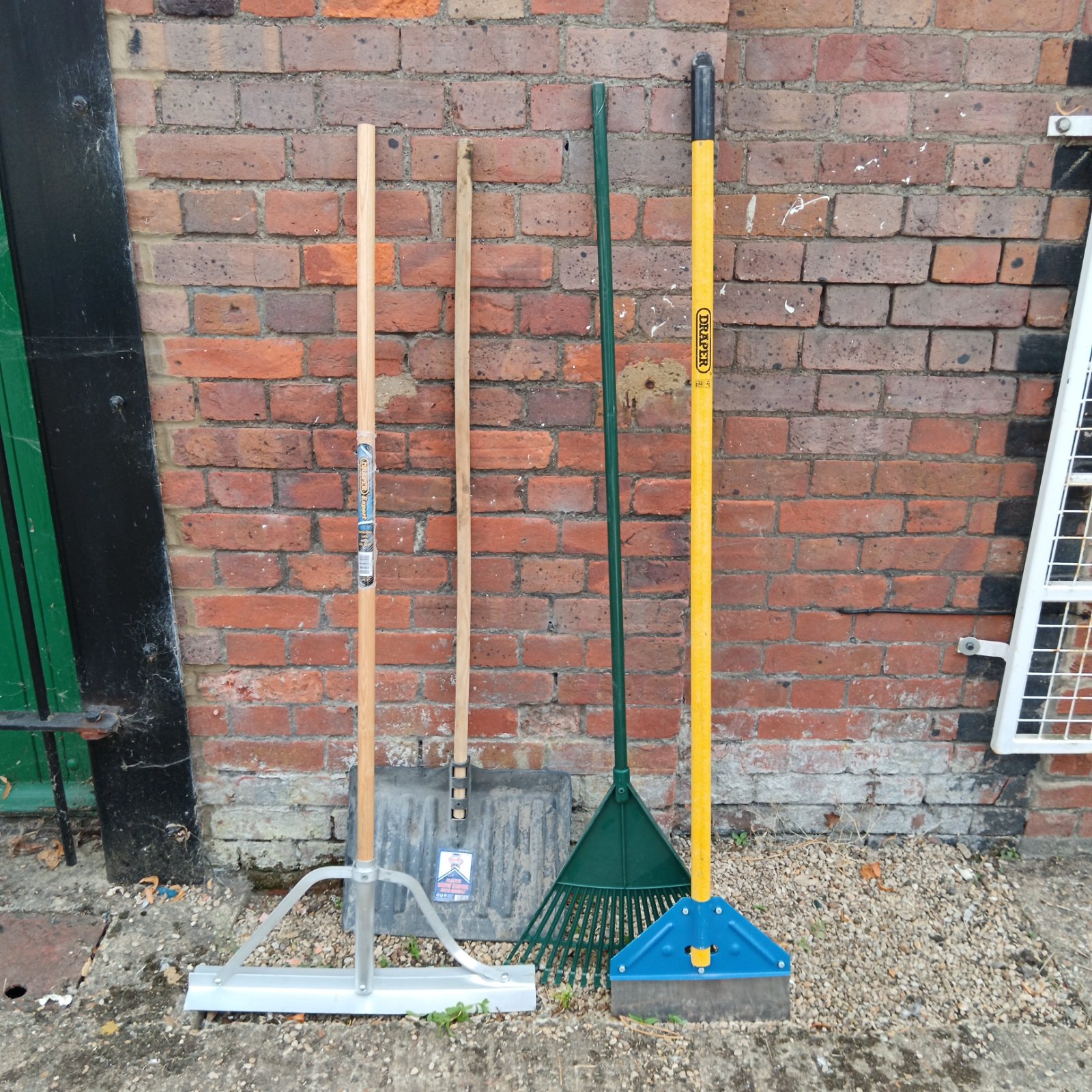 Garden tool set including Draper smoothing lute, scraper, rake and snow shovel.