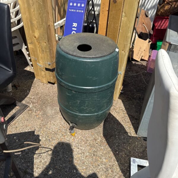 Small plastic garden water butt with tap for rainwater harvesting.