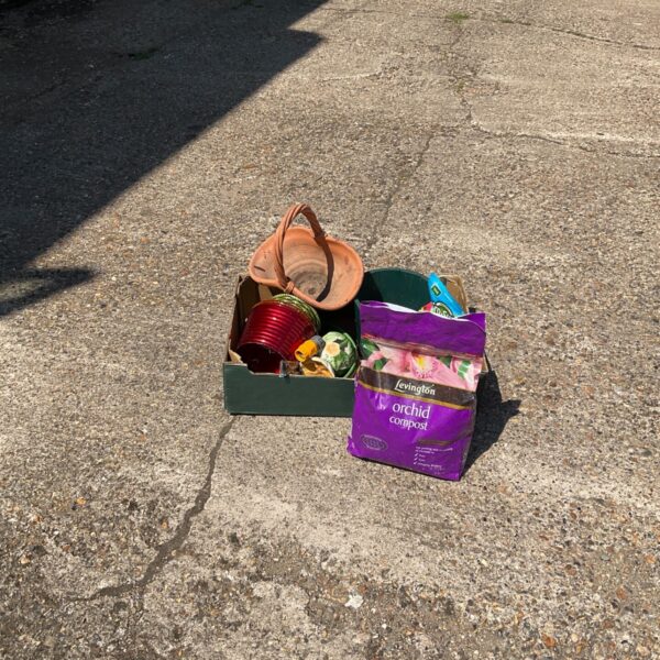 Mixed lot of gardening items including terracotta pots and orchid compost.