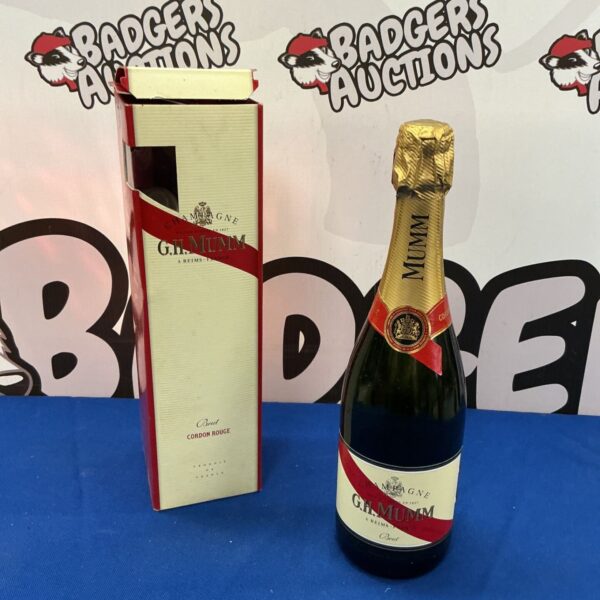 Vintage G.H. Mumm Champagne bottle with red sash.