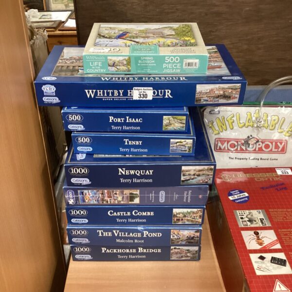 Nine Gibson jigsaw puzzles depicting classic British scenery.