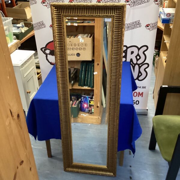 Elegant gilt framed rectangular wall mirror for home decor.