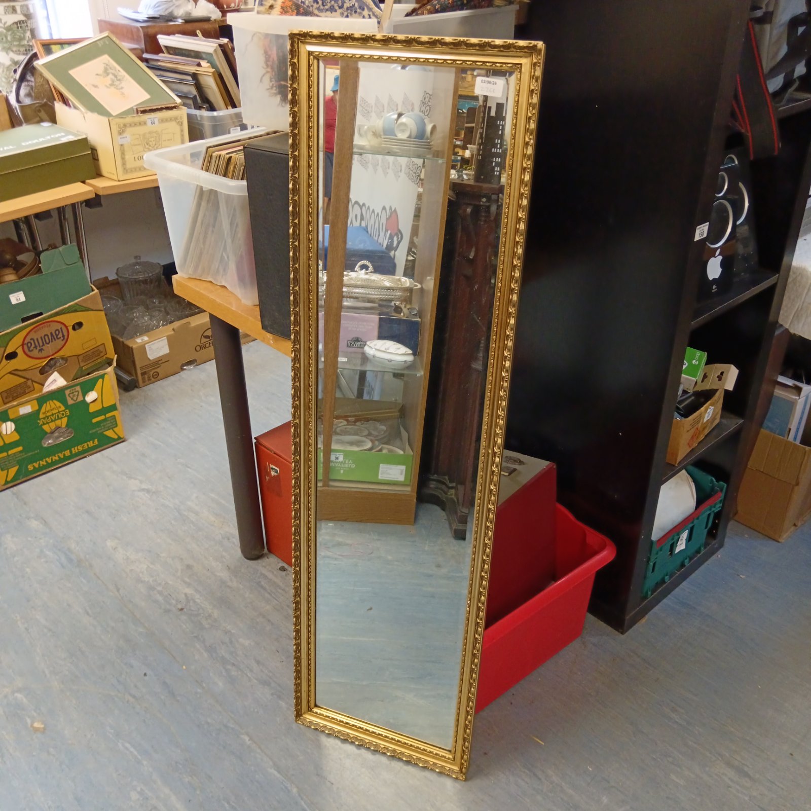 Antique gilt hall mirror with bevelled edge, measuring 137cm x 36cm.