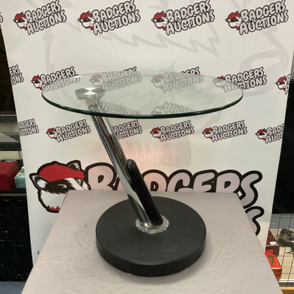 Circular glass coffee table with a modern design and 60cm diameter glass top.