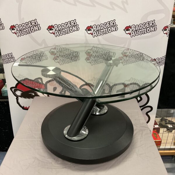 Front view of a rotating circular glass table.