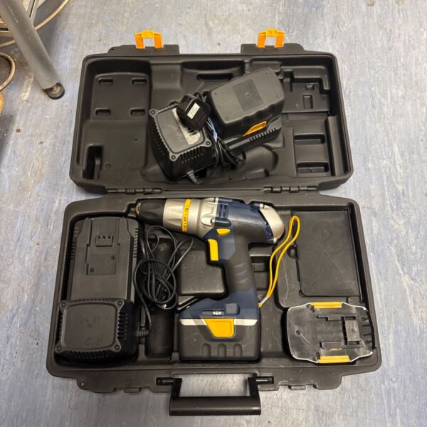 Open GMC cordless drill set with batteries and chargers.