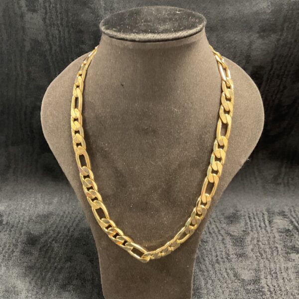 Heavy gauge gold plated curb chain necklace on display.