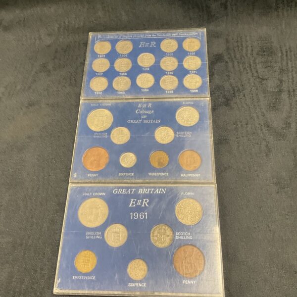 Vintage Great Britain coin proof sets in blue display case.