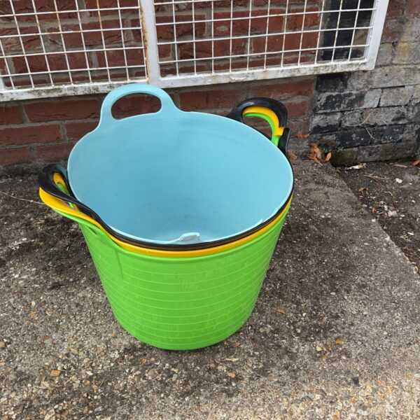 Green plastic builders bucket for garden or construction use.