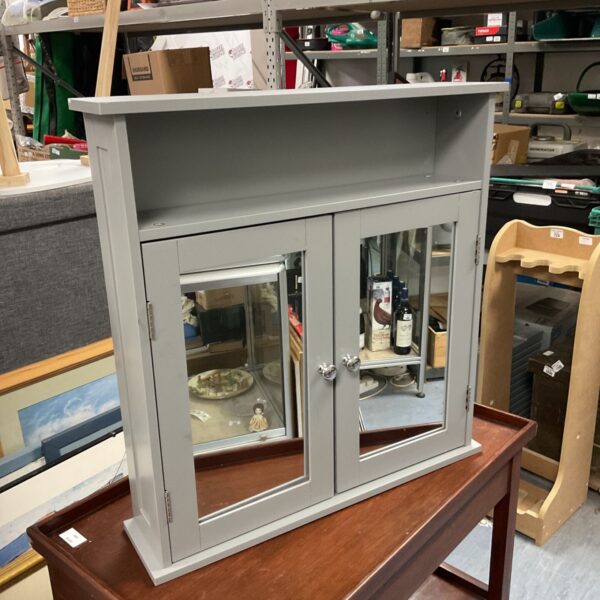Grey mirrored bathroom cabinet with two doors, ideal for bathroom storage.