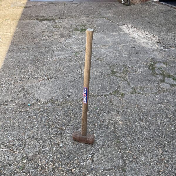 Vintage Griffin sledge hammer with wooden handle and steel head.