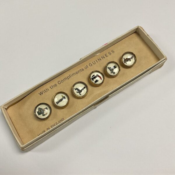 Vintage Guinness enamel buttons in original box.