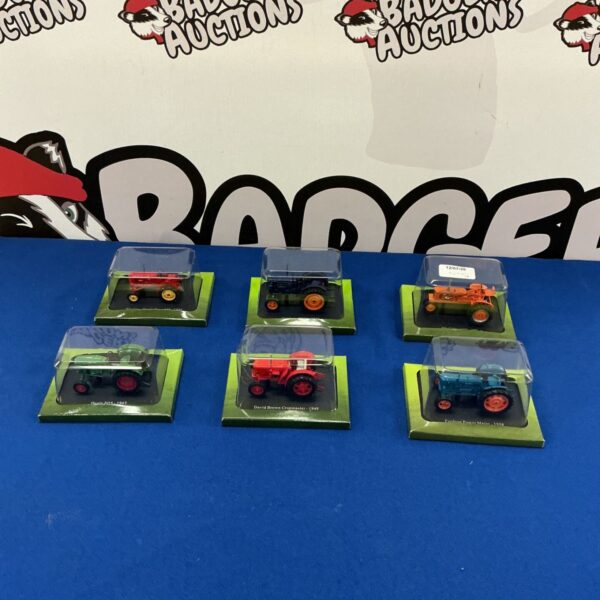Six Hachette Partworks diecast model tractors displayed together.