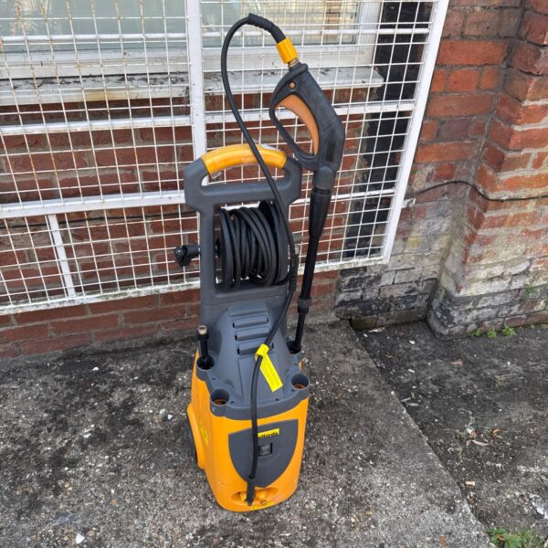Large yellow Halfords pressure washer with hose reel for garden cleaning.