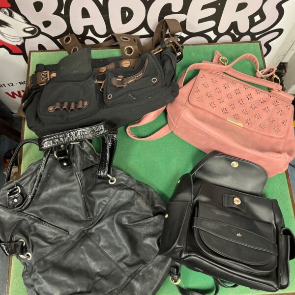 Assorted vintage handbags and purses in a collection.