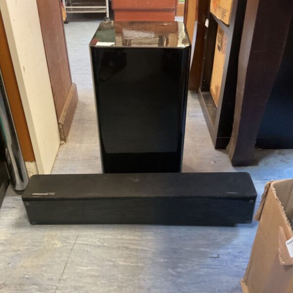 Black Harman Kardon subwoofer for home theater audio system.
