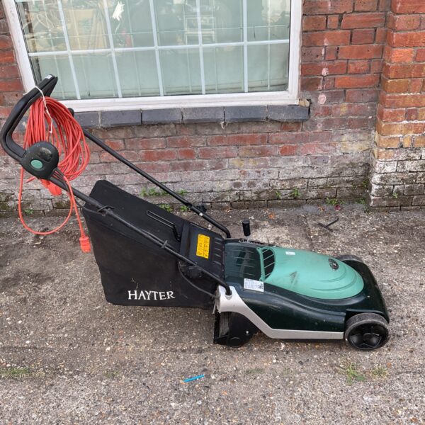 Hayter Spirit 41 electric lawnmower in a garden setting.