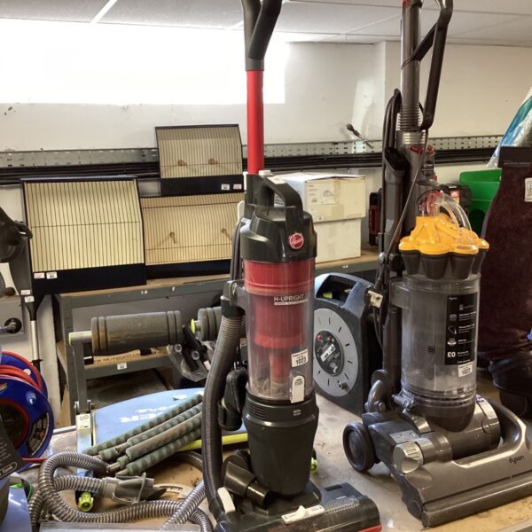 Red and grey Hoover H-Upright 300 vacuum cleaner on display.