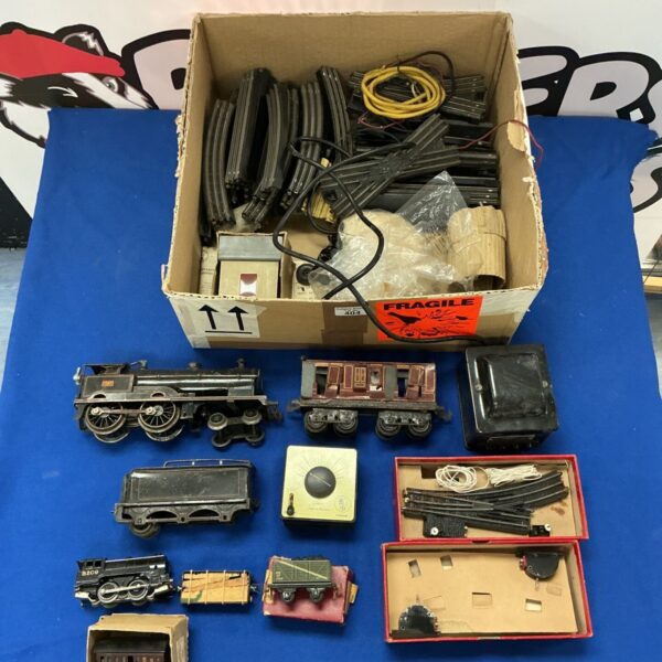 Vintage Hornby O Gauge train set with carriages and accessories.