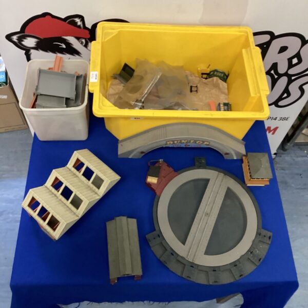 Vintage Hornby scenery pieces in a plastic storage box.