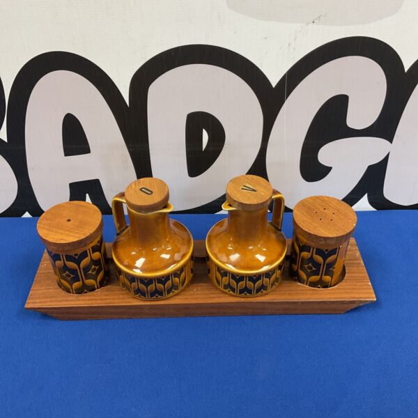 Vintage Hornsea Pottery condiment set on wooden base.
