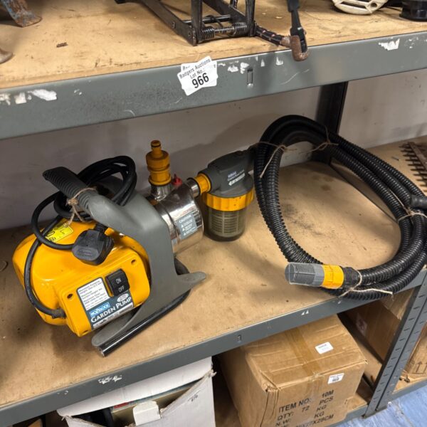 Yellow Hozelock electric garden pump for water transfer.