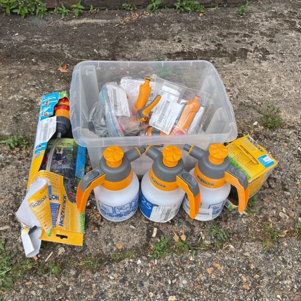 Job lot of Hozelock sprayers and garden accessories in a plastic container.
