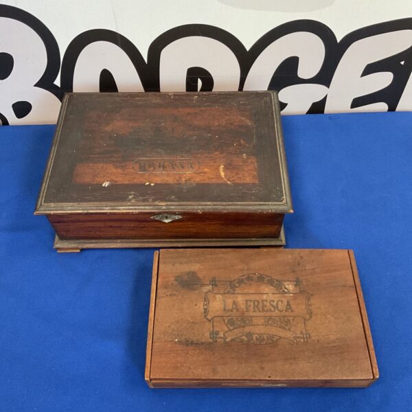 Vintage H Upmann Havana cigar box with dark wood finish.