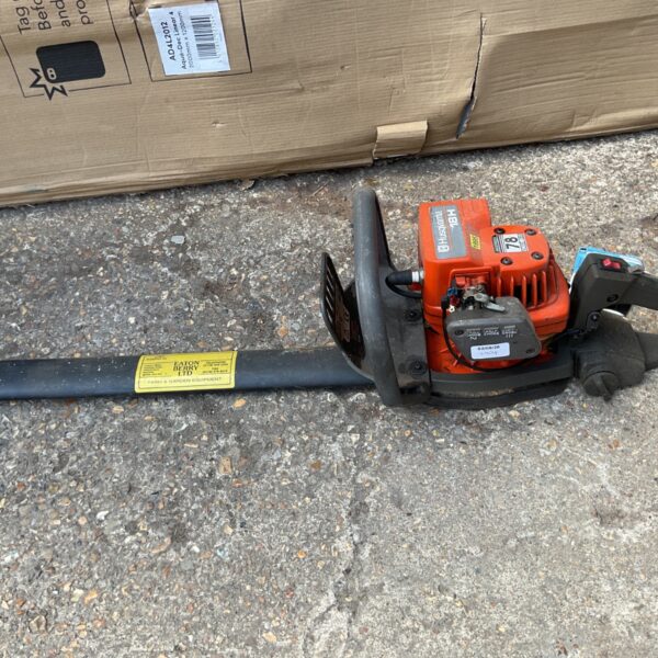 Husqvarna 129L petrol hedge cutter for garden maintenance.