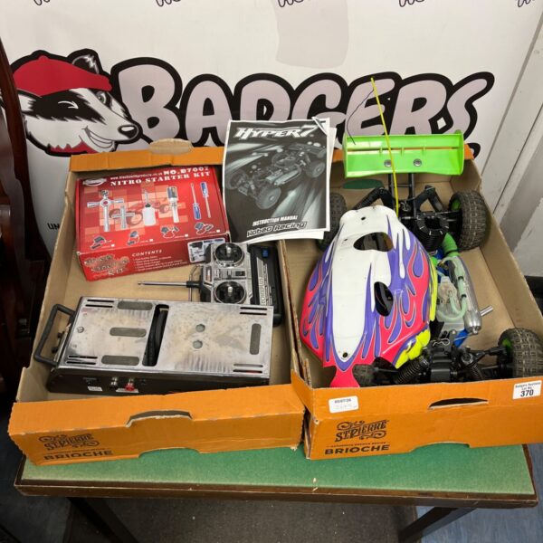 Hyper 7 nitro racing car with remote control and accessories.
