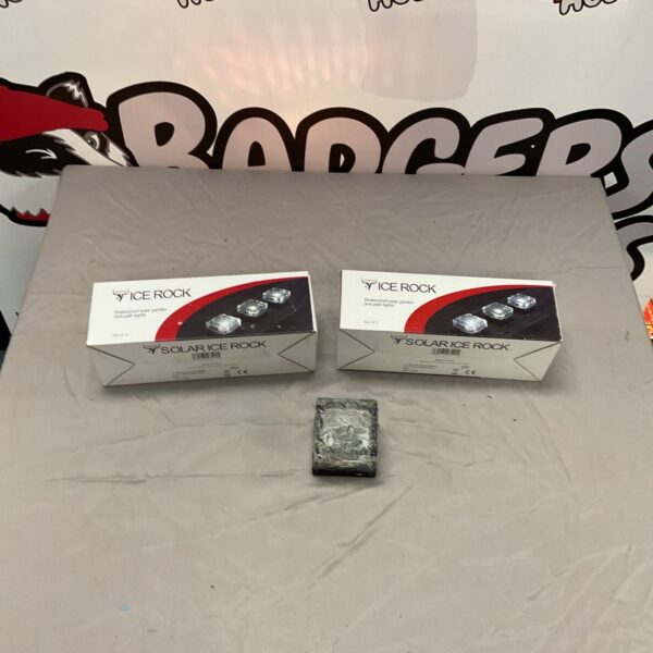 Four Ice Rock solar path lights in original packaging.