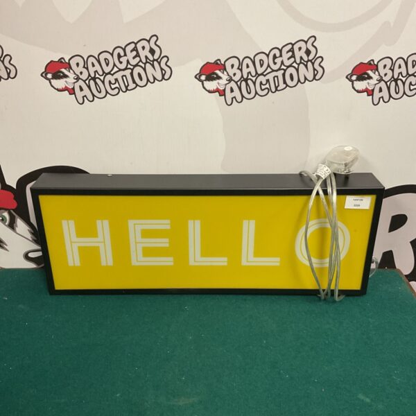 Illuminated "Hello" sign with a bright yellow background.