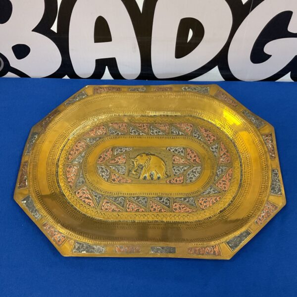 Intricate Indian brass tray with elephant design and copper silver inlay.