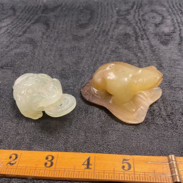 Pair of green jade money toads, Chinese Feng Shui symbols.