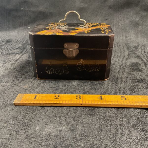 Antique Japanese lacquer ink well box with gold floral details.