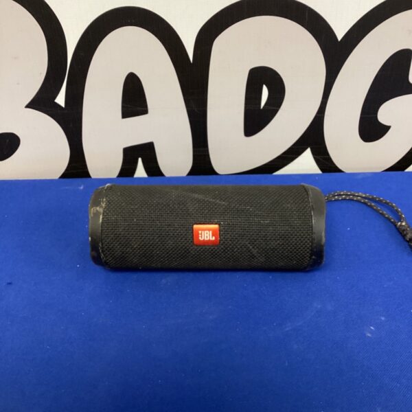 JBL Flip 4 wireless speaker in a dark grey colour.