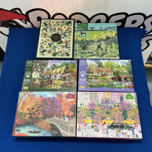 Jigsaw puzzle lot including Galison and Archive puzzles with corner piece.