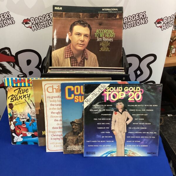 Vinyl record lot featuring Jive Bunny and Jim Reeves records.