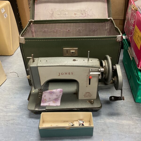 Vintage Jones D63 hand cranked sewing machine in carrying case.