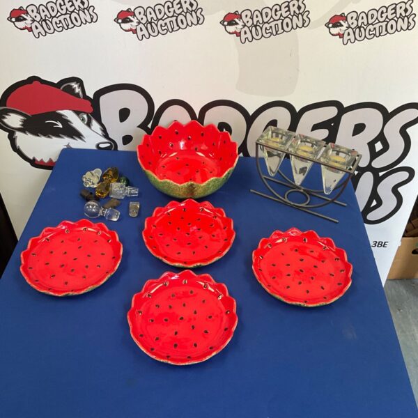 Jovani strawberry plates and bowl set on display.